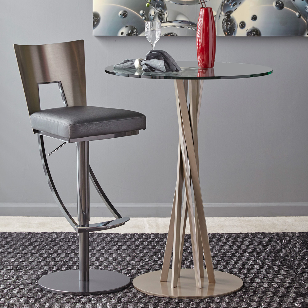 Metal grey upholstered barstools with backs and swivel and glass and metal round high top table..
