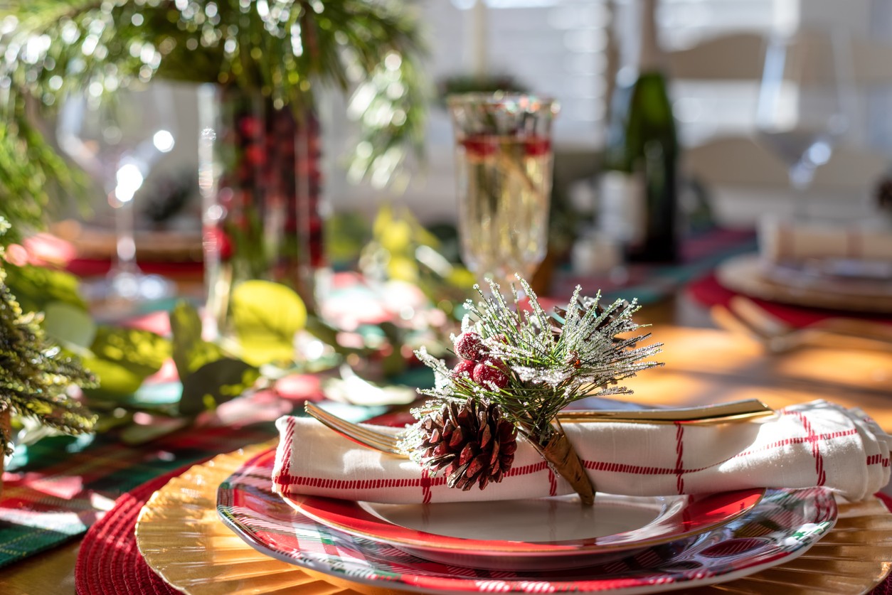 A dinette table is set for the Christmas holiday with festive decorations.