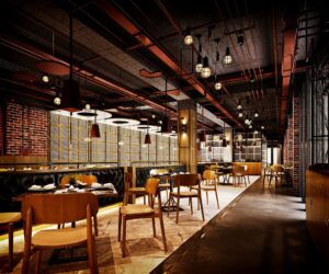 A contemporary restaurant with industrial-style decor.