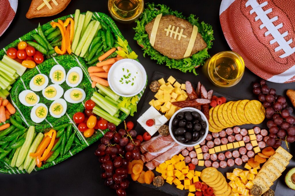 Aerial view of football game themed snacks on a table. 